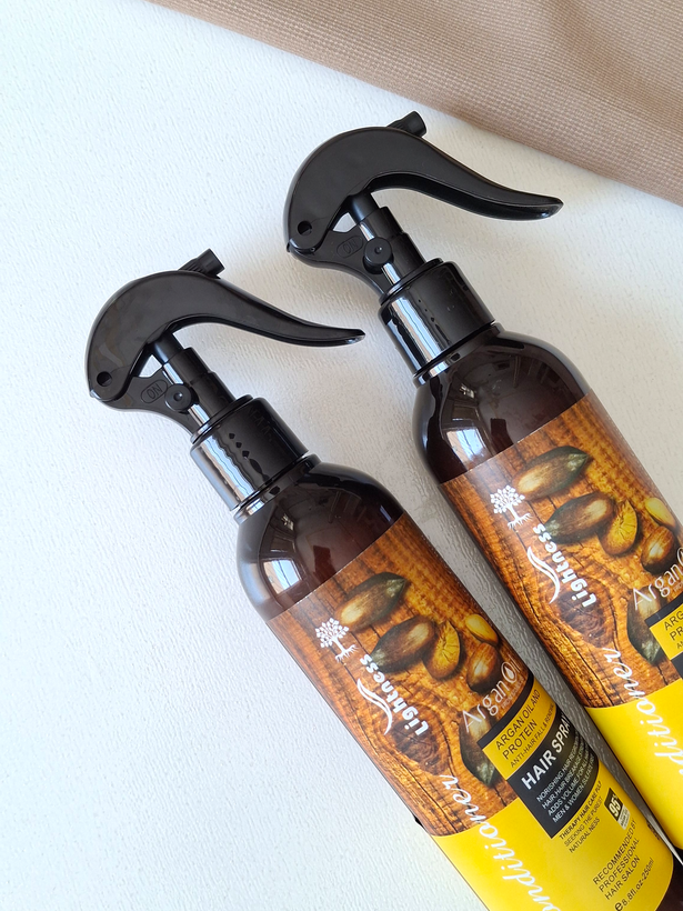 اسپری دو فاز مو آرگان لایتنس Lightness Argan Oil مدلArgan Care مناسب موهای خشک و آسیب دیده بدون سولفات حجم 250میل