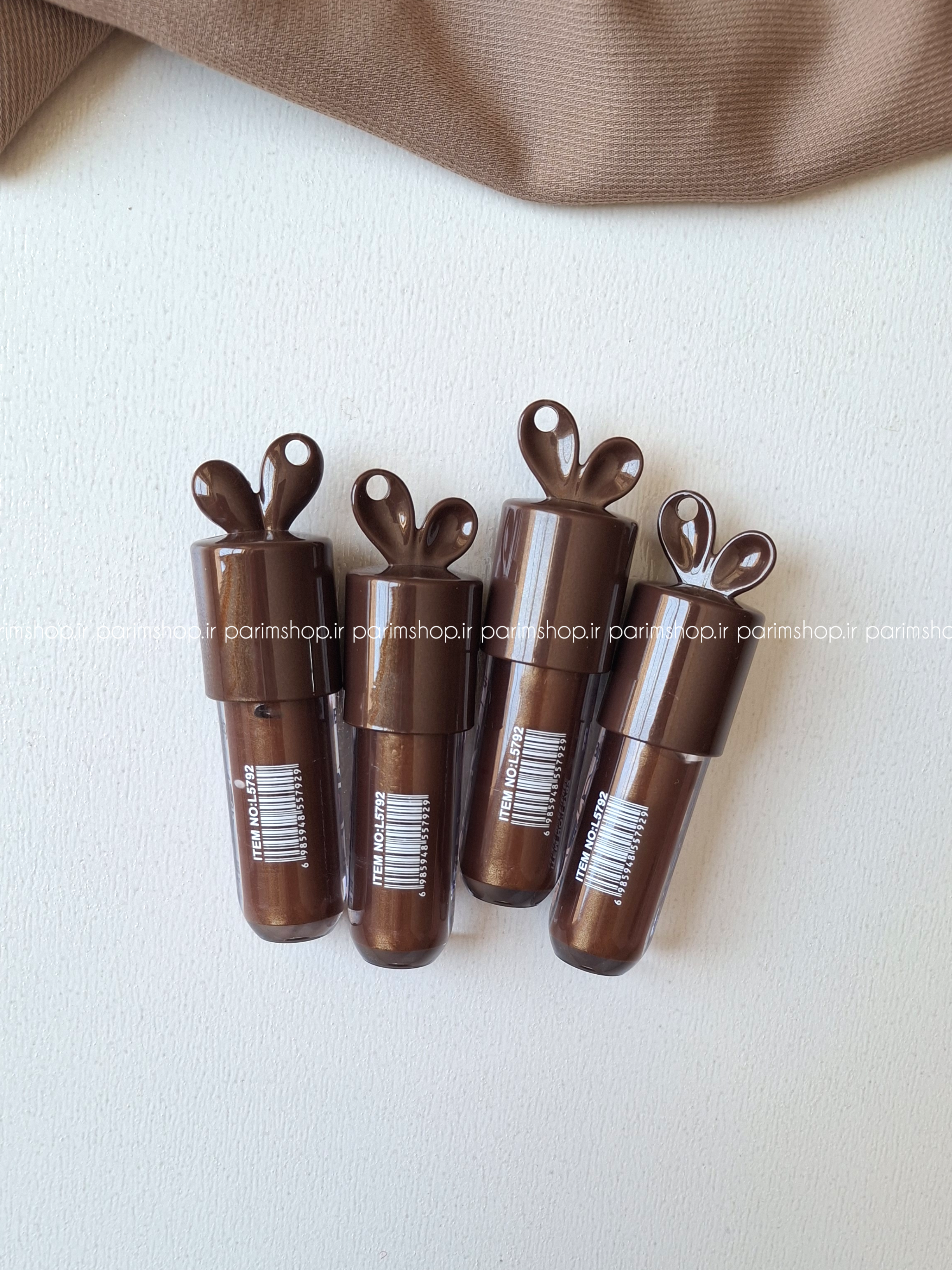 لیپگلاس شکلاتیMiss Beautiy ایجاد جلوه ای گرم و دلنشین و درخشش براقیت لب